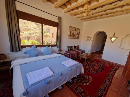 Postel nebo postele na pokoji v ubytování Kasbah Chems