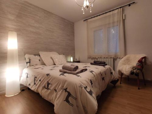 Ένα ή περισσότερα κρεβάτια σε δωμάτιο στο ALOJAMIENTO MIRABUENOS