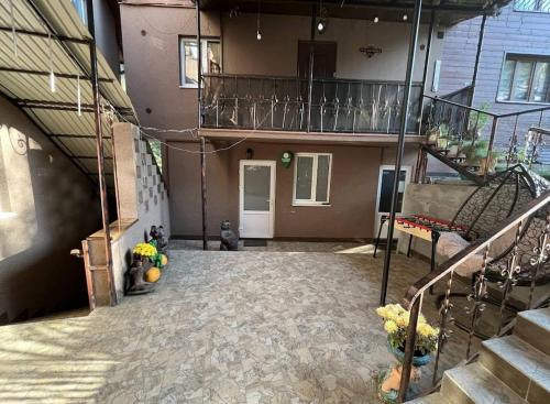 an empty room with a staircase and a house at Садиба Бункер ЧАН in Mizhhirʼʼya