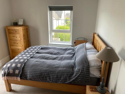 a bedroom with a bed and a window at Private Room in Saintfield in Saintfield