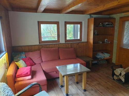 a living room with a couch and a table at horská chata Cecilie in Olešnice v Orlických horách