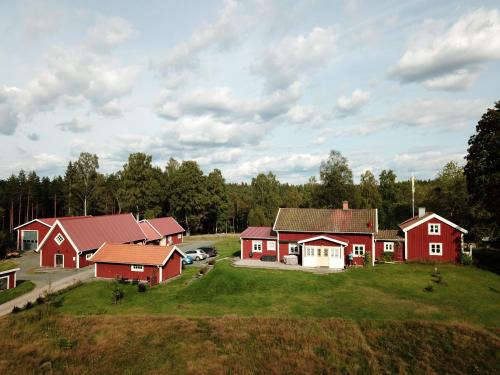 an aerial view of a farm with red houses at Smålandstorpet in Hok