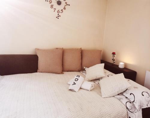 a bedroom with a large bed with pillows on it at Nice & economic Studio in Baia Mare