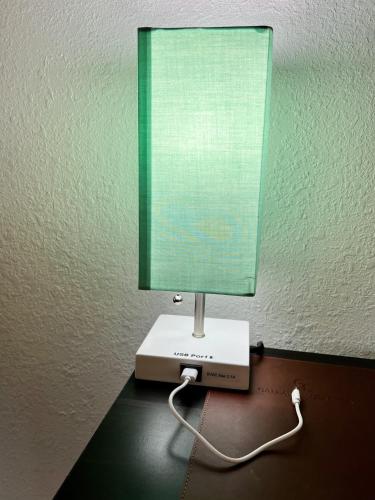 a table with a lamp on top of a desk at Leah's Homestay in Hoquiam in Hoquiam
