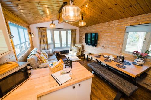 a living room with a table and a couch at Low Moor Lodge in Scarborough
