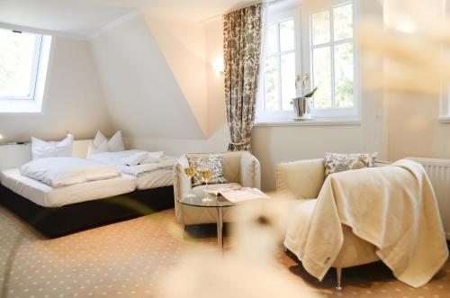 A bed or beds in a room at Hotel Waldsee