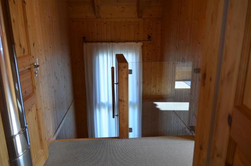a wooden room with a door and a window at Ferienhaus Kreischberg in Sankt Lorenzen ob Murau