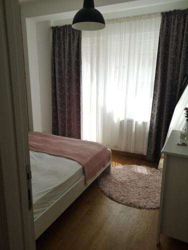 Кровать или кровати в номере Dimiant Lux Apartment