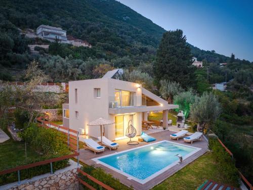 an image of a house with a swimming pool at ANATOLI VILLAS in Nikiana