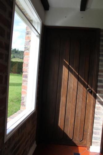 a door in a room with a window at Villa La F in Guasca