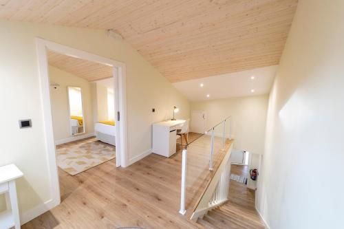 a room with a staircase leading to a bedroom at Apartamentos San Lazaro in Santiago de Compostela