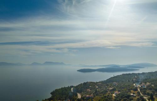 a view of a large body of water on a hill at ANATOLI VILLAS in Nikiana