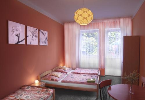 Postel nebo postele na pokoji v ubytování Hotel Pod Stráží