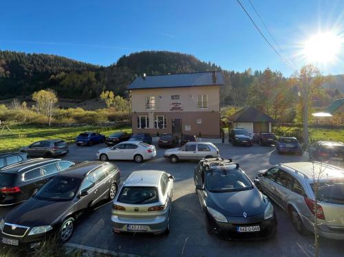 a group of cars parked in a parking lot at Apartman - Sobe Tiha Luka, Bjelašnica in Bjelašnica