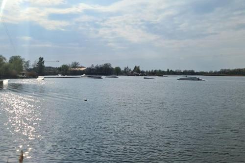 a large body of water with boats in it at Wake domek Green House Januszkowice in Januszkowice