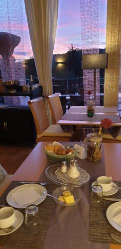 a table with a plate of food on top of it at Hotel Sonnenhof in Lügde