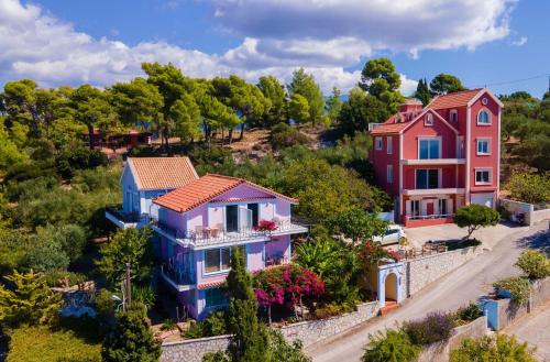 a group of houses in a village at Aeolos Studios Kefalonia in Khelmáta
