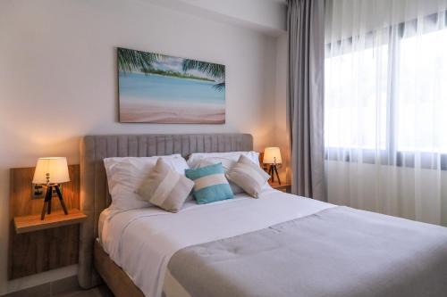 Postel nebo postele na pokoji v ubytování BGB2 Amazing apartment steps to playa Bavaro with private picuzzi