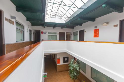 a staircase in a building with a skylight at Casa Andina Standard Cusco Catedral in Cusco