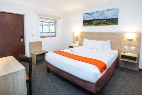 a bedroom with a large bed in a hotel room at Casa Andina Standard Cusco Catedral in Cusco