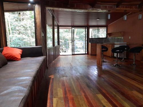 a living room with a couch and a table at Cabañas La Montaña Mountain Lodge in Monteverde Costa Rica