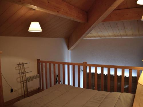 a bedroom with a bed and a wooden ceiling at Appartement Font-Romeu-Odeillo-Via, 3 pièces, 6 personnes - FR-1-580-77 in Font-Romeu-Odeillo-Via