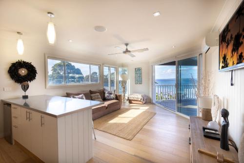 Ένα ή περισσότερα κρεβάτια σε δωμάτιο στο Hyamptons Beach House Hyams Beach