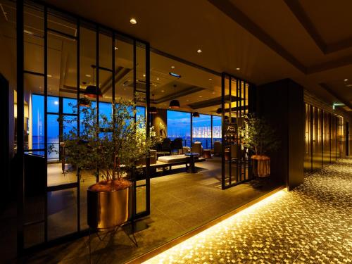 an office lobby with a view of the city at Grandvrio Hotel Beppuwan Wakura - ROUTE INN HOTELS - in Beppu