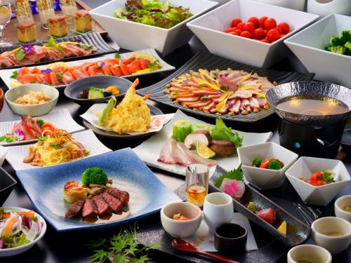 a buffet with many different types of food on a table at Grandvrio Hotel Beppuwan Wakura - ROUTE INN HOTELS - in Beppu