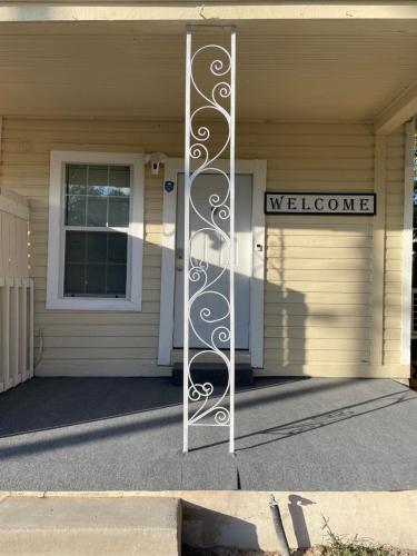 a door to a house with a welcome sign on it at Downtown Heaven in San Antonio