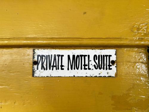 a sign on a wooden door that reads private noise shuttle at Coolangatta Estate Shoalhaven Heads in Berry