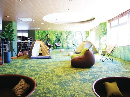 a room with a bunch of tents and chairs at The Legato Inn MIFUNE in Mifune