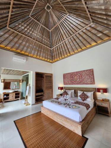Ένα ή περισσότερα κρεβάτια σε δωμάτιο στο Pinggala Villa Ubud