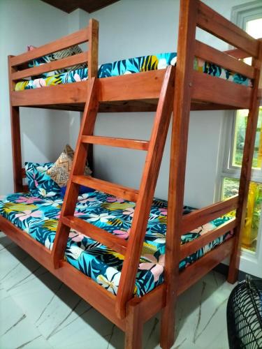 a bunk bed in a room at Bolo Beach Santorini nearby to Hundred Island in Alaminos