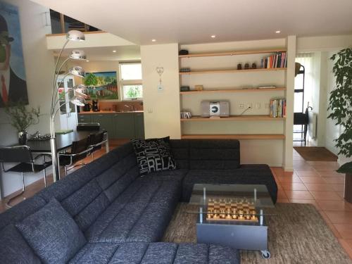 a living room with a couch and a table at Near Amsterdam, The Hague, Leiden and North Sea in Warmond
