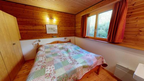 Postel nebo postele na pokoji v ubytování Tschuggen 11