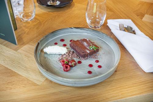 a plate of food on a table with food on it at The Wynnstay Hotel, Oswestry, Shropshire - The Coaching Inn Group in Oswestry