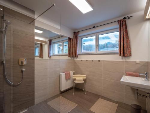 a bathroom with a shower and a sink at Appartements SILVA in Hopfgarten im Brixental