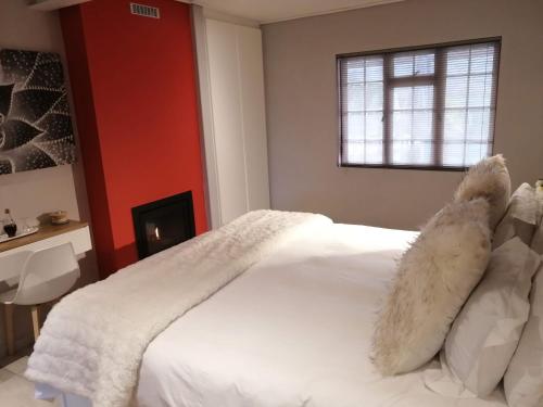 Ένα ή περισσότερα κρεβάτια σε δωμάτιο στο Lauradale Accommodation