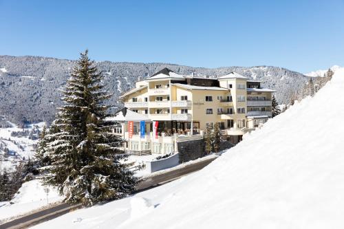 a large building on top of a snow covered mountain at Wellness Aparthotel Panorama Alpin - Ferienwohnungen Jerzens im Pitztal in Jerzens