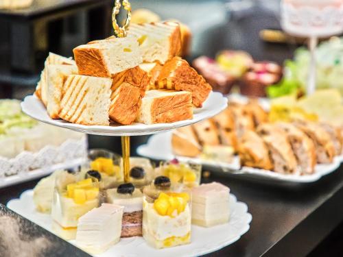 a display of different types of cakes and desserts at Primus Hotel Nanchang International Expo City in Nanchang