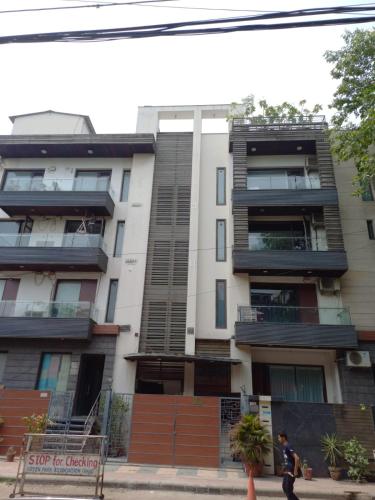 a building with balconies on the side of it at Olive Service Apartments - Green Park in New Delhi