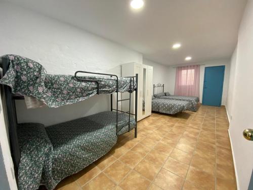 Postel nebo postele na pokoji v ubytování La casa del olivo