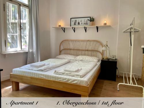 En eller flere senge i et værelse på Marburg Living