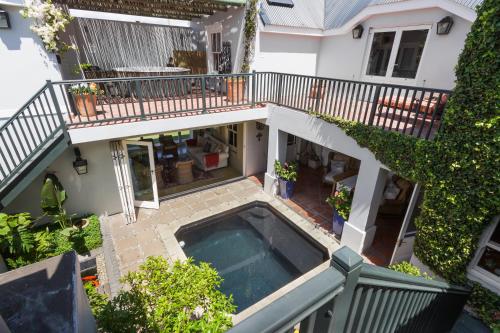 an overhead view of a house with a swimming pool at Strand Beach Lodge in Strand