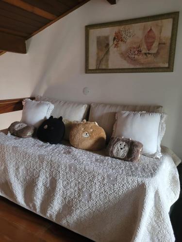 a group of stuffed animals sitting on a bed at Apto Duplex com Mezanino in Juquei
