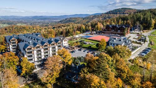 an aerial view of a resort in the mountains at Kazalnica Family&Conference Resort in Sosnówka