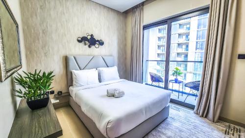 Postel nebo postele na pokoji v ubytování STAY BY LATINEM Luxury 1BR Holiday Home CV A2304 near Burj Khalifa
