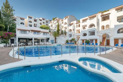 a large swimming pool in front of a building at Holiday Park Santa Ponsa in Santa Ponsa