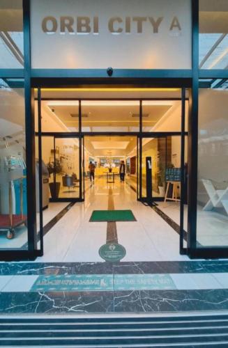 a view of the entrance to an office building at Next Wave Aparthotel in Batumi
